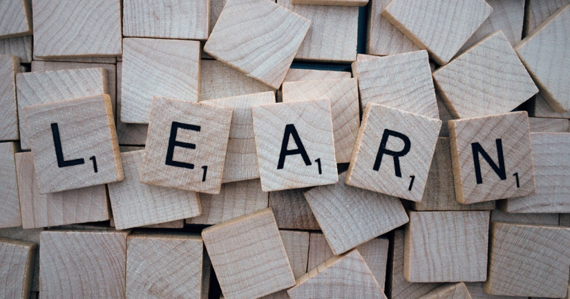 Scrabble tiles spelling the word LEARN