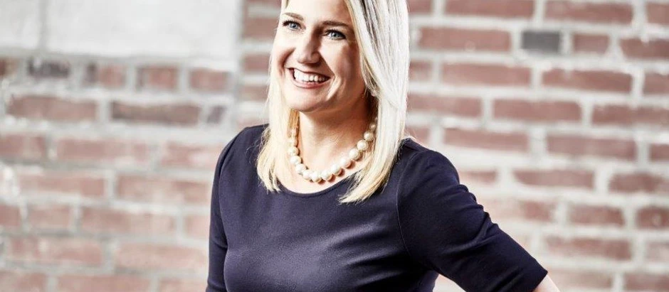 Portrait of Cassandra Sanford, CEO of Kelly Mitchell Group